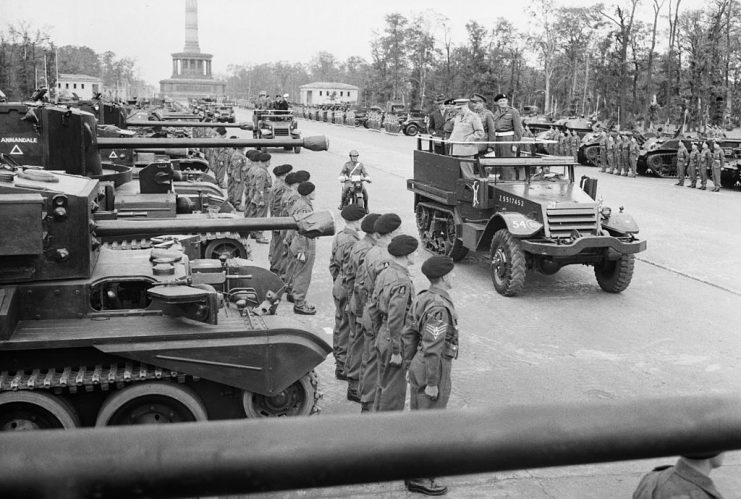 Winston Churchill In Berlin, July 1945, Prime Minister Winston Churchill, accompanied by Field Marshal Sir Bernard Montgomery and Field Marshal Sir Alan Brooke, inspects tanks of the ‘Desert Rats’ from a half-track vehicle which moved slowly along the long line of troops and armour, during the British Victory parade in Berlin, 21 July 1945. (Photo by Capt. W T Lockeyear/ Imperial War Museums via Getty Images)