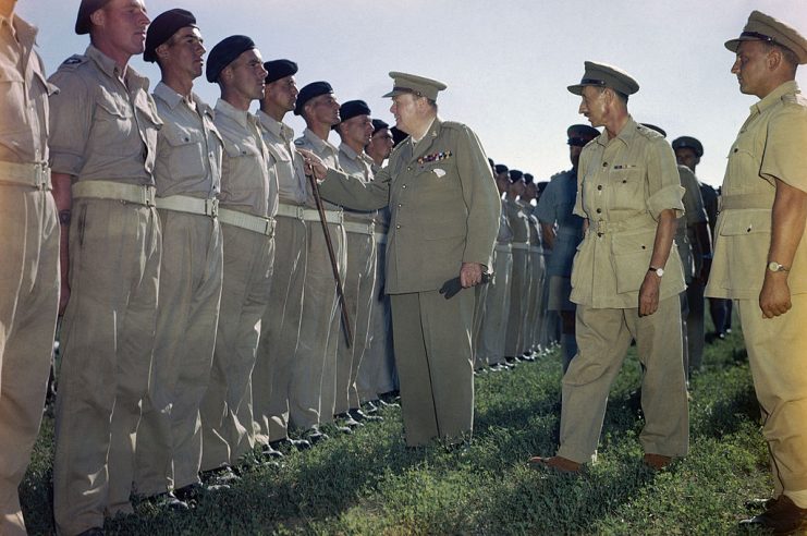 Winston Churchill At Loreto Aerodrome In Italy, 25 August 1944, The Prime Minister, the Rt Hon Winston Churchill, MP, inspecting the ranks of the 4th Queen’s Own Hussars, the regiment with which he served before entering politics. At the time of his visit the Prime Minister was Colonel-in-Chief of the Regiment. He is accompanied by the Commander of the Regiment, Lieutenant R C Kidd. General Sir Harold Alexander, the Supreme Allied Commander in the Mediterranean, is partially visible in the background, 25 August 1944. (Photo by Capt. Tanner/ Imperial War Museums via Getty Images)