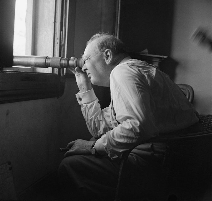 Winston Churchill During The Second World War In Italy, The Prime Minister Winston Churchill watches an assault against enemy positions north of Florence, Italy, through a telescope from the observation post of a battery of the 66 Lowland Medium Regiment, Royal Artillery, on 20 August 1944. (Photo by Capt. Tanner/ Imperial War Museums via Getty Images)