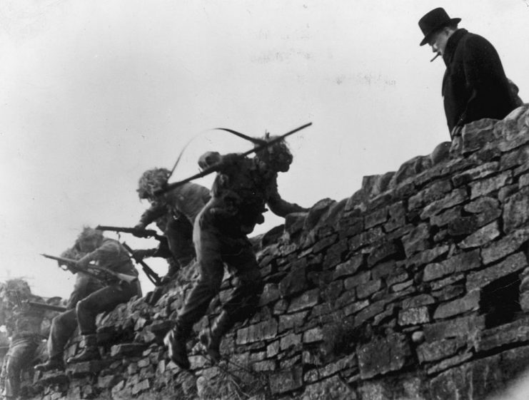 1942: British Prime Minister Winston Churchill watching soldiers on an assault course at GHQ Battle School at Northern Command at Barnard Castle. (Photo by A. A. Englander/Hulton Archive/Getty Images)