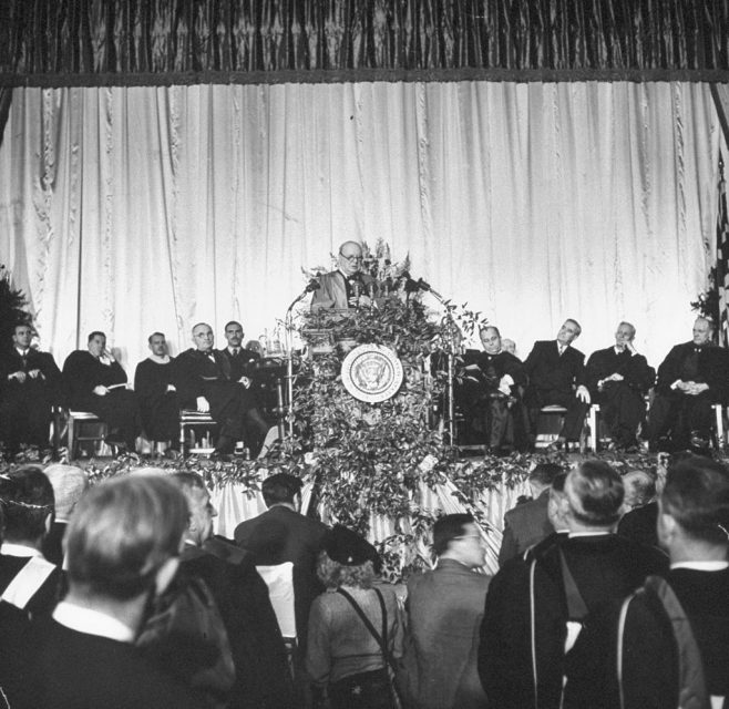 March 1946: US Pres. Harry S. Truman (stage, L) listening to British PM Winston Churchill make a speech regarding the Communist threat which became famous as the Iron Curtain speech. (Photo by George Skadding/The LIFE Picture Collection via Getty Images)