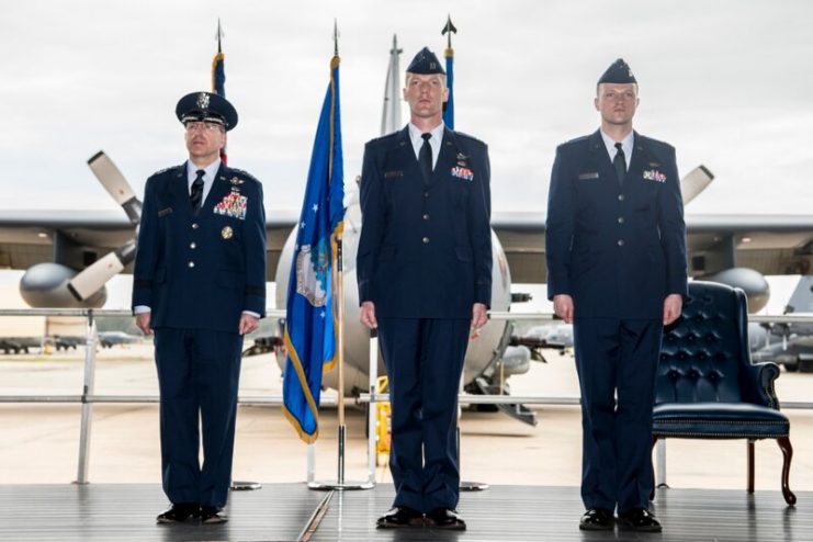 Lt. Gen. Jim Slife, commander of Air Force Special Operations Command, presents two Distinguished Flying Crosses to Capt. Neils Aberhalden, commander of Spooky 41, and navigator Capt. John Crandall during a ceremony at Hurlburt Field, Florida, Mar. 2. (Senior Airman Joseph Leveille/Air Force)