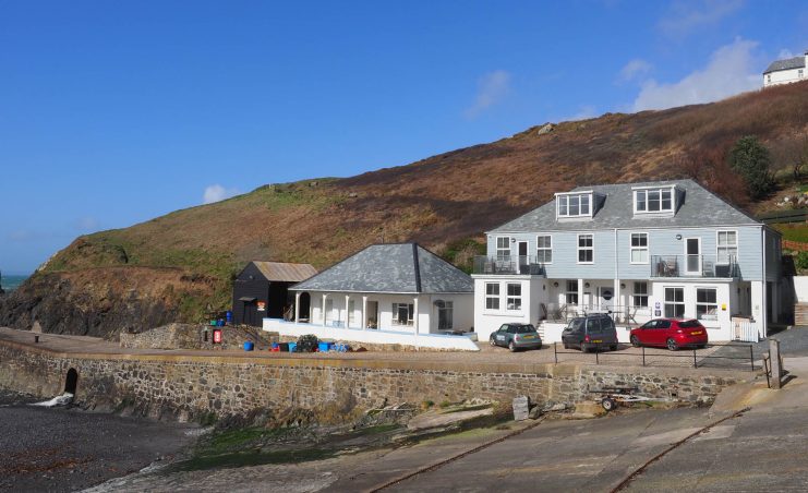 Mullion Cove Hotel apartment building right. Mullion, Cornwall. Photo: Geoff Moore.