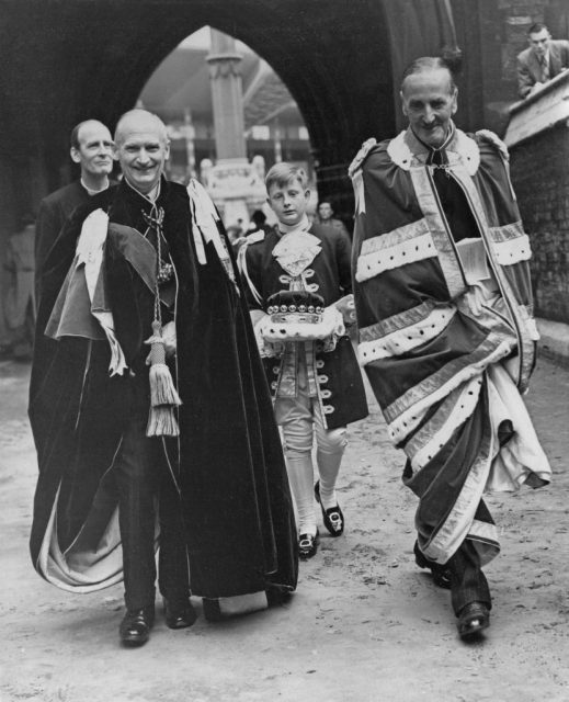 Field-Marshall Viscount Montgomery (L) and Sir Rupert de la Bere, Lord Mayor of London (R), leaving Westminster Abbey after the full dress rehearsal for the Coronation Ceremony, 29th May 1953. Nicholas Wright, page to Viscount Montgomery, is seen in the middle. (Fox Photos/Getty Images)
