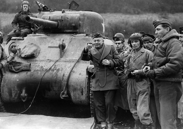American General Dwight Eisenhower (1890 – 1969) and Air Marshal Arthur Tedder (1890 – 1967), in front of a Sherman tank during tank and infantry demonstrations and invasion force manoeuvres, February 26, 1944. Eisenhower was later elected the 34th President of the United States. (Photo by Keystone/Getty Images)