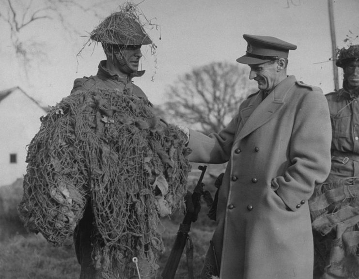 circa 1942: General Montgomery (1887 – 1976) meets a camouflaged Home Guard on a tactical training course in South Eastern Command. (Photo by Fox Photos/Getty Images)
