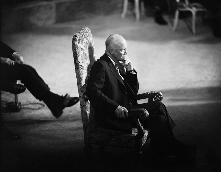 After the opening speech at a commemorative session of the United Nations, President Eisenhower sits center stage listening to San Francisco’s Mayor Robinson delivering his welcome address.