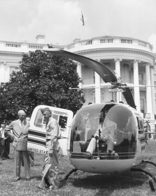 View of US President Dwight D Eisenhower (1890 – 1969) (left, with hand on hip) as he prepares to board a helicopter on the White House grounds, Washington DC, July 12, 1957. He was to leave for a ‘relocation point’ as part of nation-wide Civil Ddefense exercises. (Photo by United States Information Agency/PhotoQuest/Getty Images)