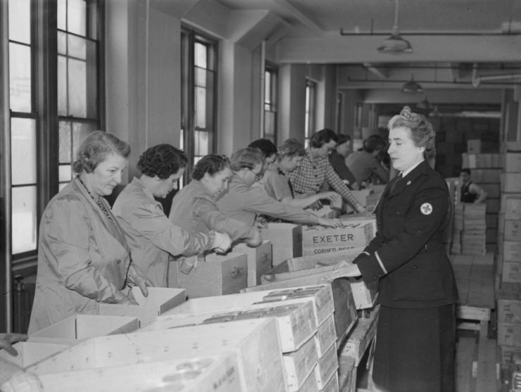 Women volunteers of the Canadian Society of the Red Cross prepare packages that will be sent to prisoners of war.