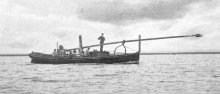 A steamboat with a spar torpedo, in transport position