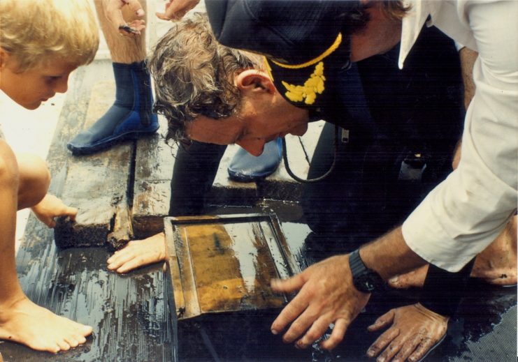 Dr. Holland on dive site with US Sanitary Commission Box