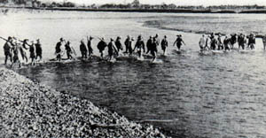 Squadron under Captain Pajota crosses the Pampanga River on their way to their ambush position at the Cabu Bridge. Approximately 6 P.M. January 30, 1945.