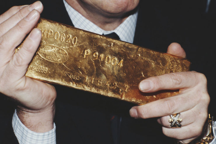 British salvage diver Keith Jessop (1933 – 2010) of Jessop Marine, holding the first gold bar recovered from the British cruiser ‘HMS Edinburgh’, circa 1981. (The bar’s estimated value is £130,000.) The vessel sank in 1942 during World War II, while carrying a cargo of gold bullion to Russia as payment for military equipment. (Photo by Keystone/Hulton Archive/Getty Images)