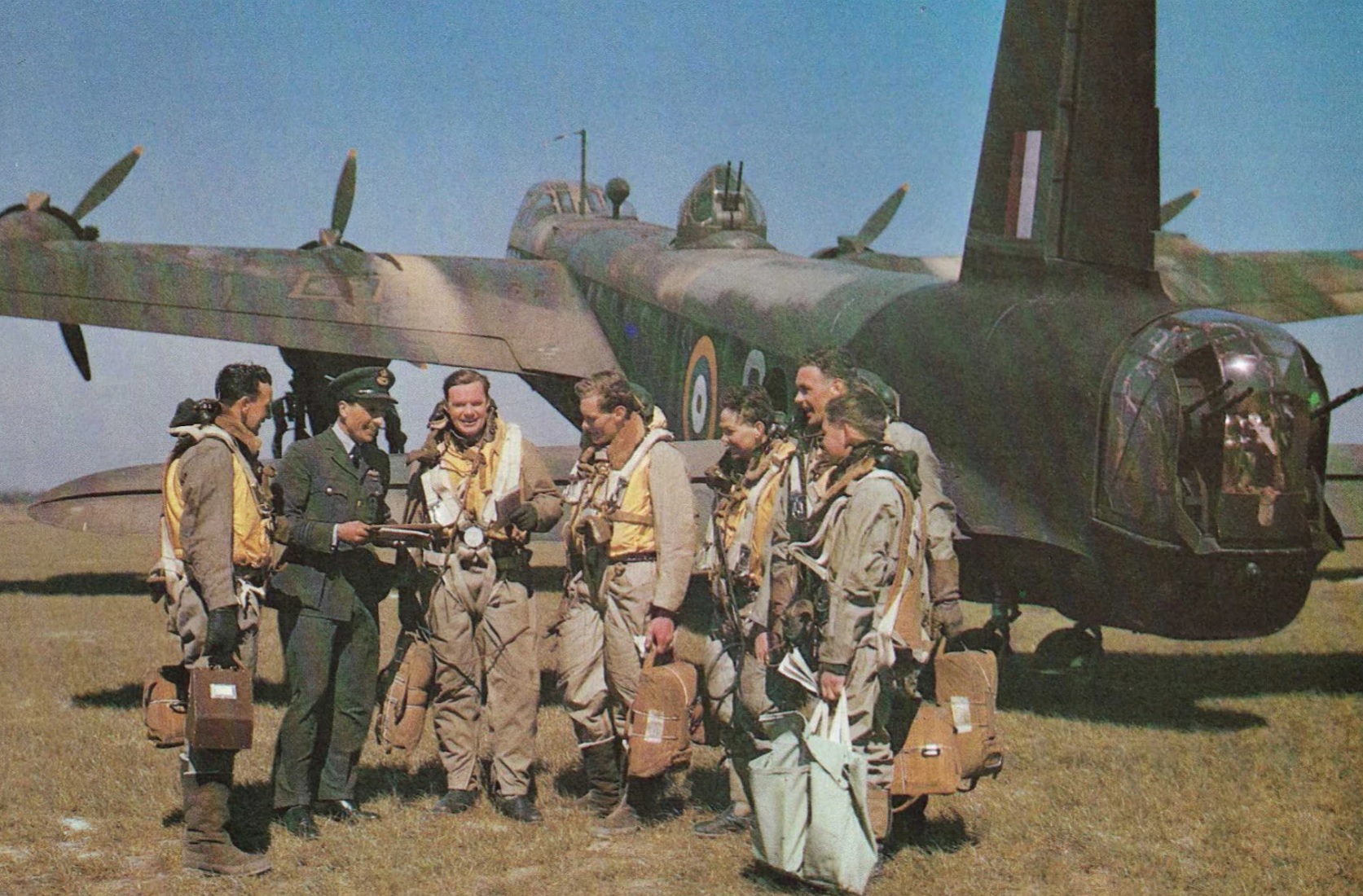 Captain Barr is third left. The RAF bomber crew being briefed in Cambridgeshire just weeks before their fateful mission in 1942.