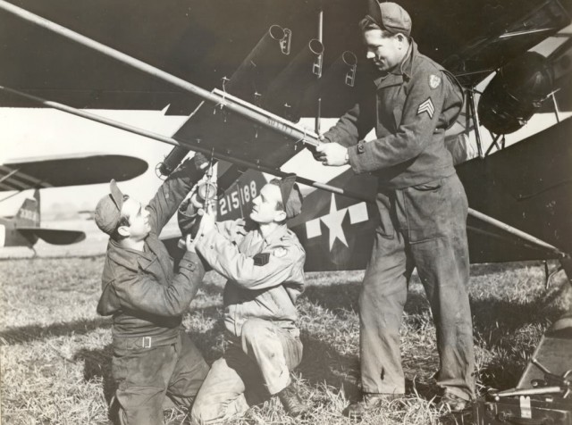 Diving through a barrage of German infantry fire during a continual sequence of assaults against the Nazi formation, Carpenter emptied all of his bazooka tubes that were bolted to his Piper L-4H