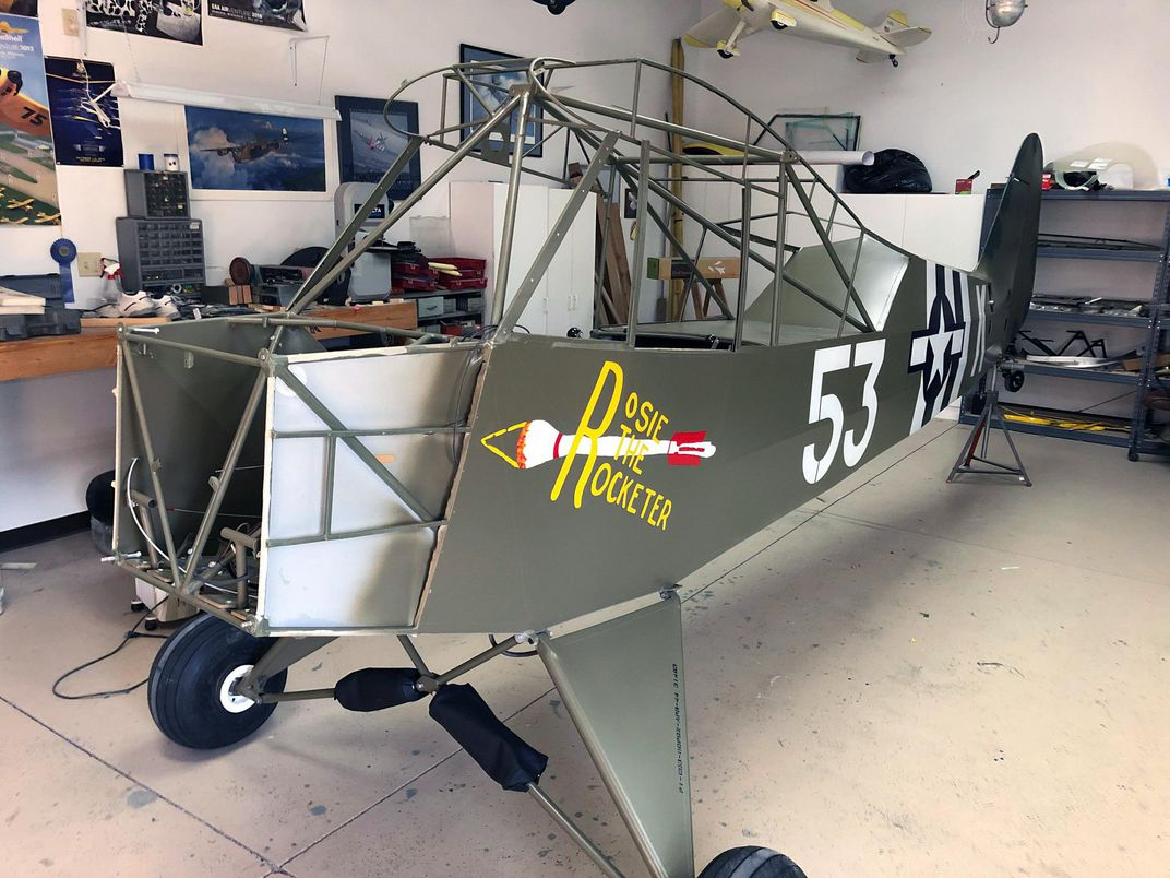 Carol Apacki’s daughter, a graphic designer, re-painted the nose art that her grandfather had painted 75 years earlier. (Colin Powers)