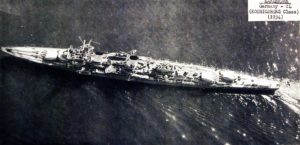 An aerial view of the Karlsruhe in 1934, showing her offset turrets.