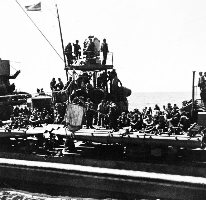 Battle of Midway, 4 June 1942: The U.S. Navy destroyer USS Benham (DD-397), with 720 survivors of the aircraft carrier USS Yorktown (CV-5) on board, closes the heavy cruiser USS Portland (CA-33) at about 1900 hrs. A report of unidentified aircraft caused Benham to break away before transferring any of the survivors to the cruiser and they remained on board her until the following morning. Note Benham’s oil-stained sides.