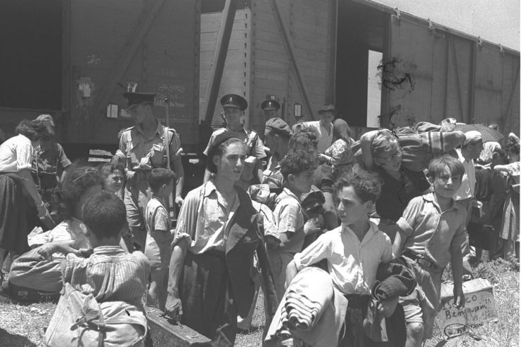 CHILDREN RESCUED FROM THE NAZI CAMPS ARRIVING AT THE ATLIT RECEPTION CAMP BY TRAIN.