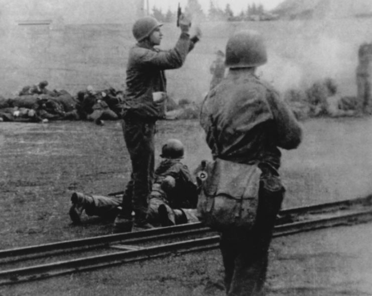 Lt. Col. Felix Sparks halting men executing captured SS guards at Dachau.