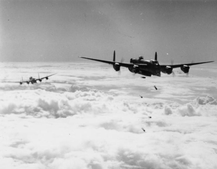 Lancaster bombers release their bomb loads over northern France.
