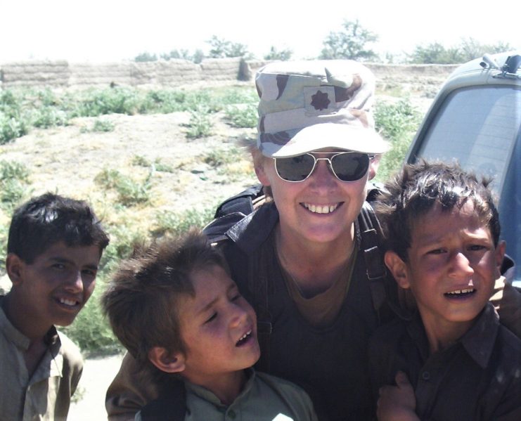 Carol Jean Dameron Bailey of California enlisted it the Women’s Army Corps of the U.S. Army in 1976. She would later serve in the National Guard and Army Reserve, achieving the rank of lieutenant colonel. She is pictured with local children during her deployment to Afghanistan in 2003. Courtesy of Carol Jean Dameron Bailey