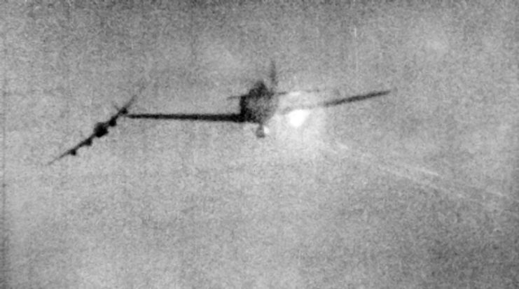 This image shows the moment a Focke-Wulf Fw 190 was shot down by a Mk III Mustang while it was attacking a Lancaster bomber.