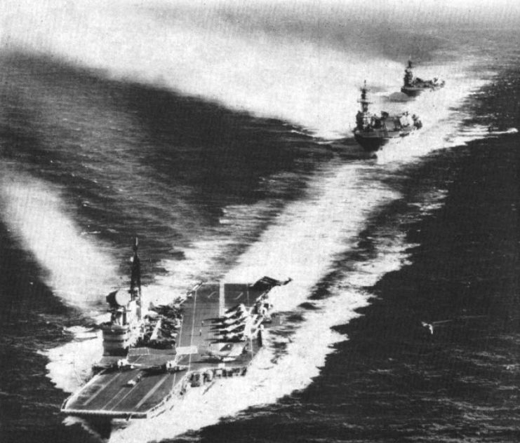 The Royal Navy aircraft carriers HMS Victorious (R38), HMS Ark Royal (R09) and HMS Hermes (R12), front to back, underway, circa 1961.
