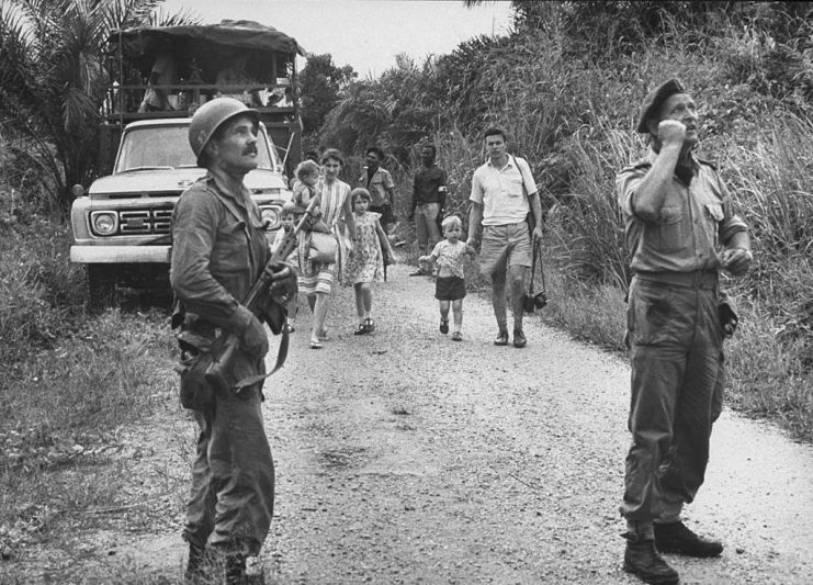 Mike Hoare (R) and Belgian Congo Armed Forces evacuating refugees after masacre. (Photo by Priya Ramrakha/The LIFE Picture Collection via Getty Images)