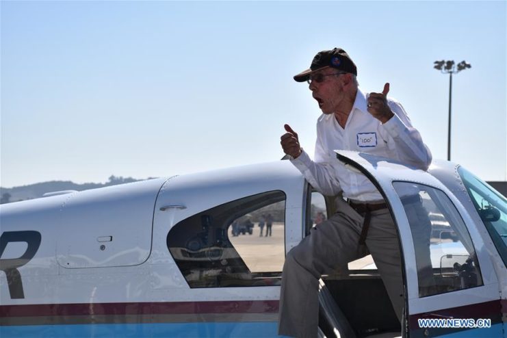 Moyer celebrates after his flight in a Mooney MK 21. Image by Xinhua Gao Shan.