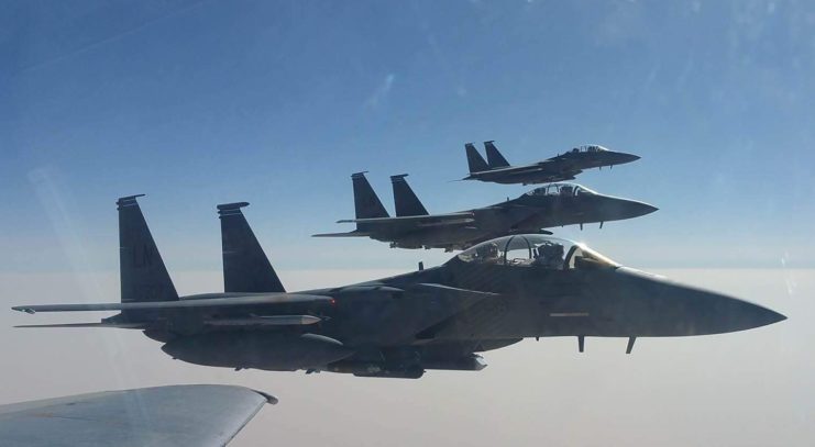 Stegeman is pictured while flying an F-15E (foreground) over Syrian airspace during a mission in 2017. Courtesy of Cole Stegeman