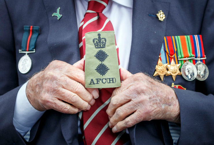 Captain Sir Tom Moore holding an honorary Colonel badge in appointment for the Army Foundation College during a visit to the Army Foundation College in Harrogate, North Yorkshire as part of his new role as Honorary Colonel of the Northern military training establishment. (Photo by Danny Lawson/PA Images via Getty Images)