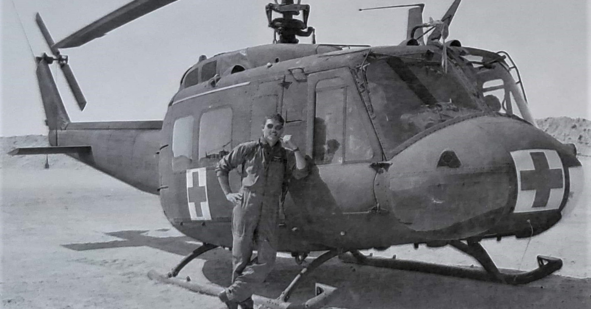 Fife is pictured next to one of the UH-1 “Huey” helicopters that he served as a crew chief aboard while deployed with an air ambulance company.  Courtesy of Matt Fife  