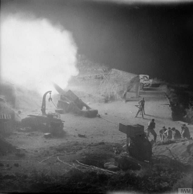 A captured Italian 305mm gun being fired at night by the British during the Battle for Catania. This was the biggest gun used during the campaign. [© IWM (NA 5474)]