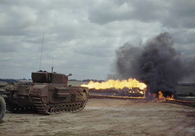 A Churchill tank fitted with a Crocodile flamethrower in action. This flamethrower could produce a jet of flame exceeding 150 yards in length [© IWM (TR 2313)].