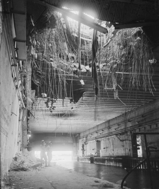 A forty-foot circle hole in the roof of a U-boat pen in Brest which had received a direct hit during the Allied bombardment.