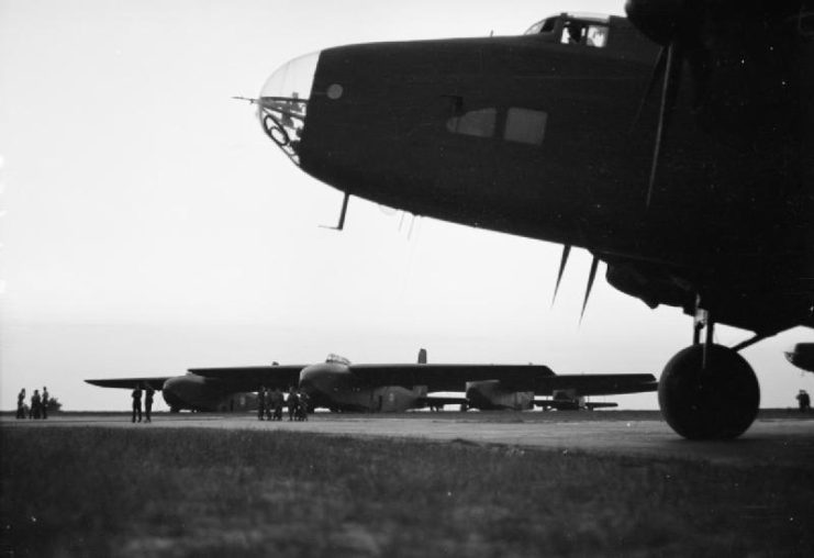 A Handley Page Halifax Mark V (foreground), and General Aircraft Hamilcar heavy gliders lined up on the main runway, await the signal to start at Tarrant Rushton, Dorset.
