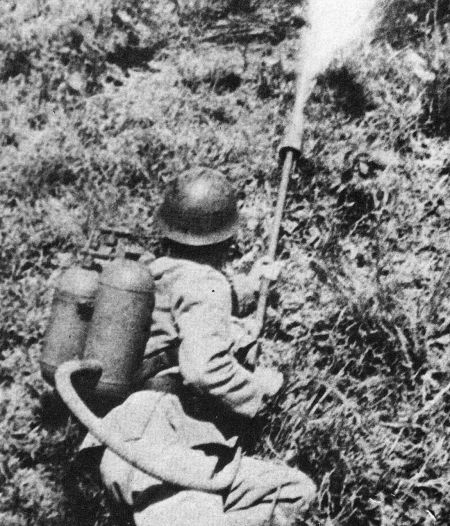A Japanese soldier firing a Type 93 flamethrower