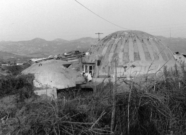 An Albanian Pike Zjarri bunker being used as a house in 1994. Image credit – Albinfo CC BY 3.0