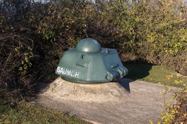 An ex-Renault R.35 tank turret atop a bunker of the Mont Canisy battery complex in France. Image credit – Pymouss CC BY-SA 4.0