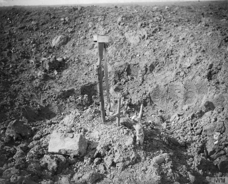 Battle of Morval. A makeshift grave in a shell-hole, marked by an inverted rifle driven into the ground near Combles.