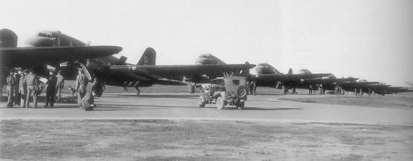 C-47s of the 91st Troop Carrier Squadron on the northwest perimeter track adjacent to the main hangar at Upottery.
