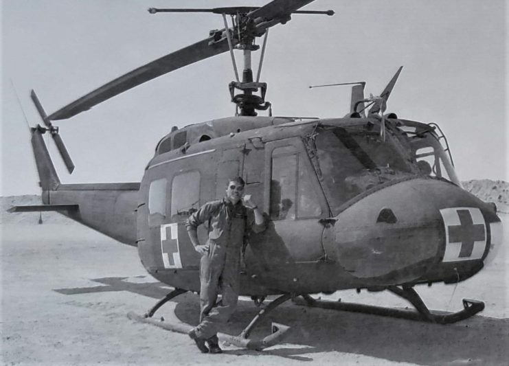 Fife is pictured next to one of the UH-1 “Huey” helicopters that he served as a crew chief aboard while deployed with an air ambulance company. Courtesy of Matt Fife