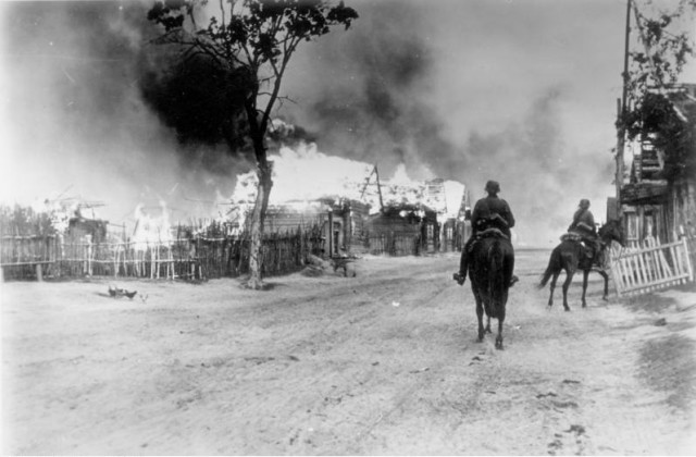 German Cavalry in village burning village, near Mohylev, 16th July 1941. Bundesarchiv