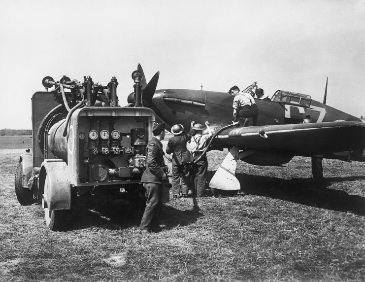 Groundcrew refuelling a Hawker Hurricane Mk I of No. 32 Squadron from a refuelling truck whilst the pilot waits in the cockpit, Biggin Hill, August 1940.