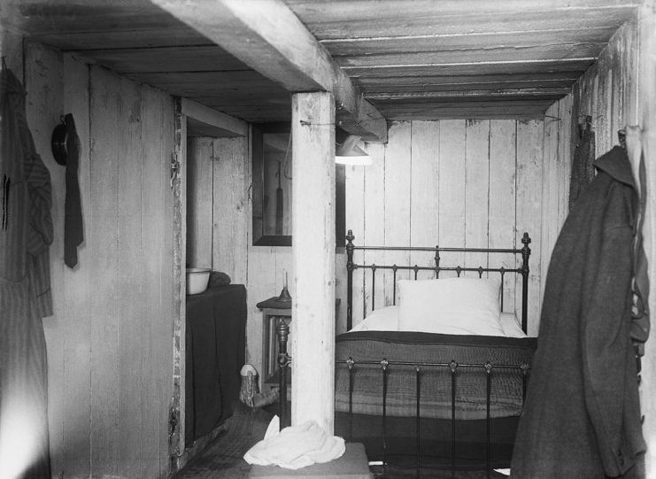 Interior of a German underground dugout complete with a brass bed at Fricourt. British troops were astonished at the comfort of German living conditions.