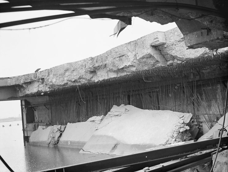 Interior of the E-boat pens at le Havre, showing the collapsed roof, caused by 12,000-lb deep-penetration ‘Tallboy’ bombs dropped by No. 617 Squadron RAF on 14 June 1944.