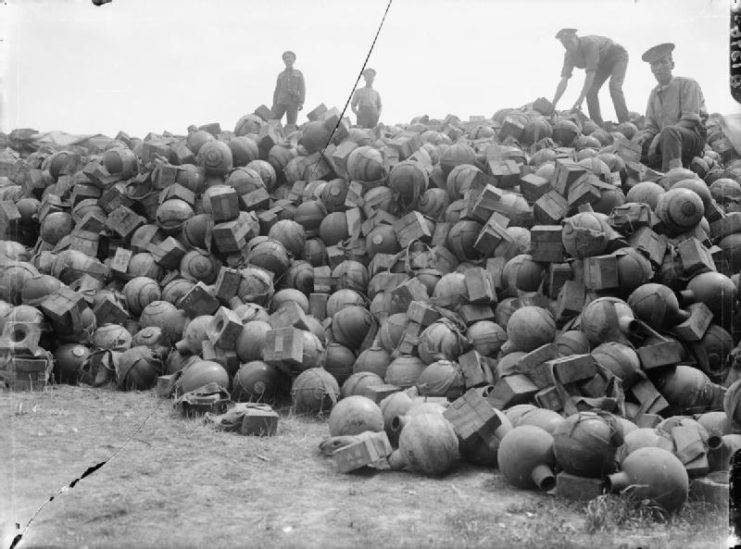 Men of the Royal Army Ordnance Corps on a dump of 2-inch trench mortar ammunition, Acheux, Somme, France.