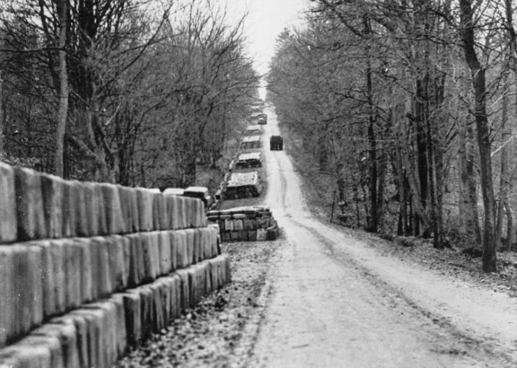 More than 400,000 5-gallon jerry cans of gasoline line five miles of road between the Belgian towns of Stavelot and Francorchamps during the Battle of the Bulge.