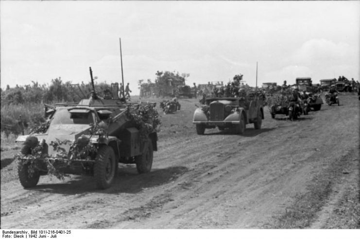 Panzer Division in movement on unpaved road, in the front Spähpanzer (Sd.Kfz. 221). Photo Bundesarchiv, Bild 101I-216-0401-25 Dieck CC-BY-SA 3.0
